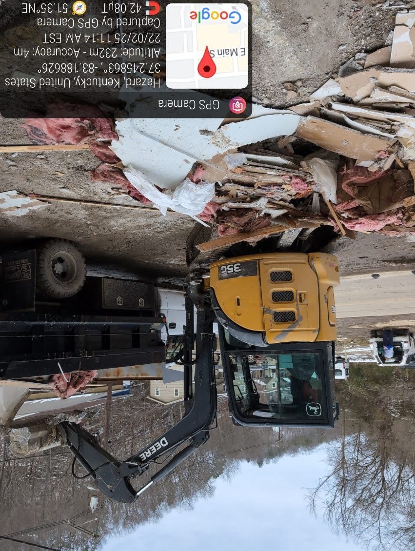 Bulldozer clearing flood debris